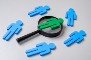 human-figures-and-magnifying-glass